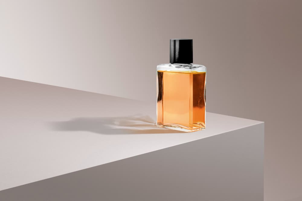Perfume bottle on pink product backdrop from a perfume online shop in Malaysia